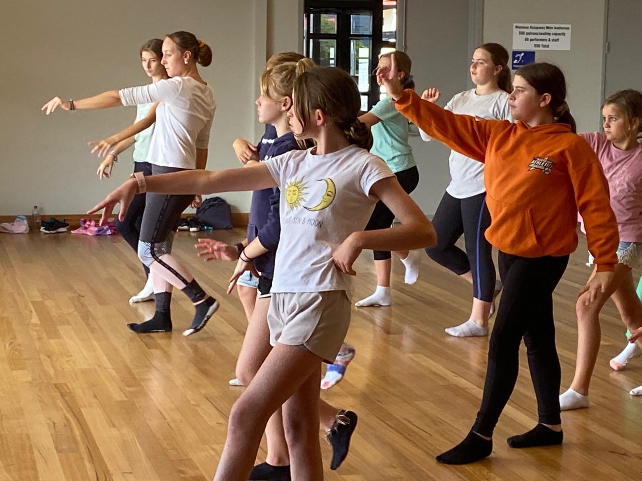 students doing a dance workshop in a hall
