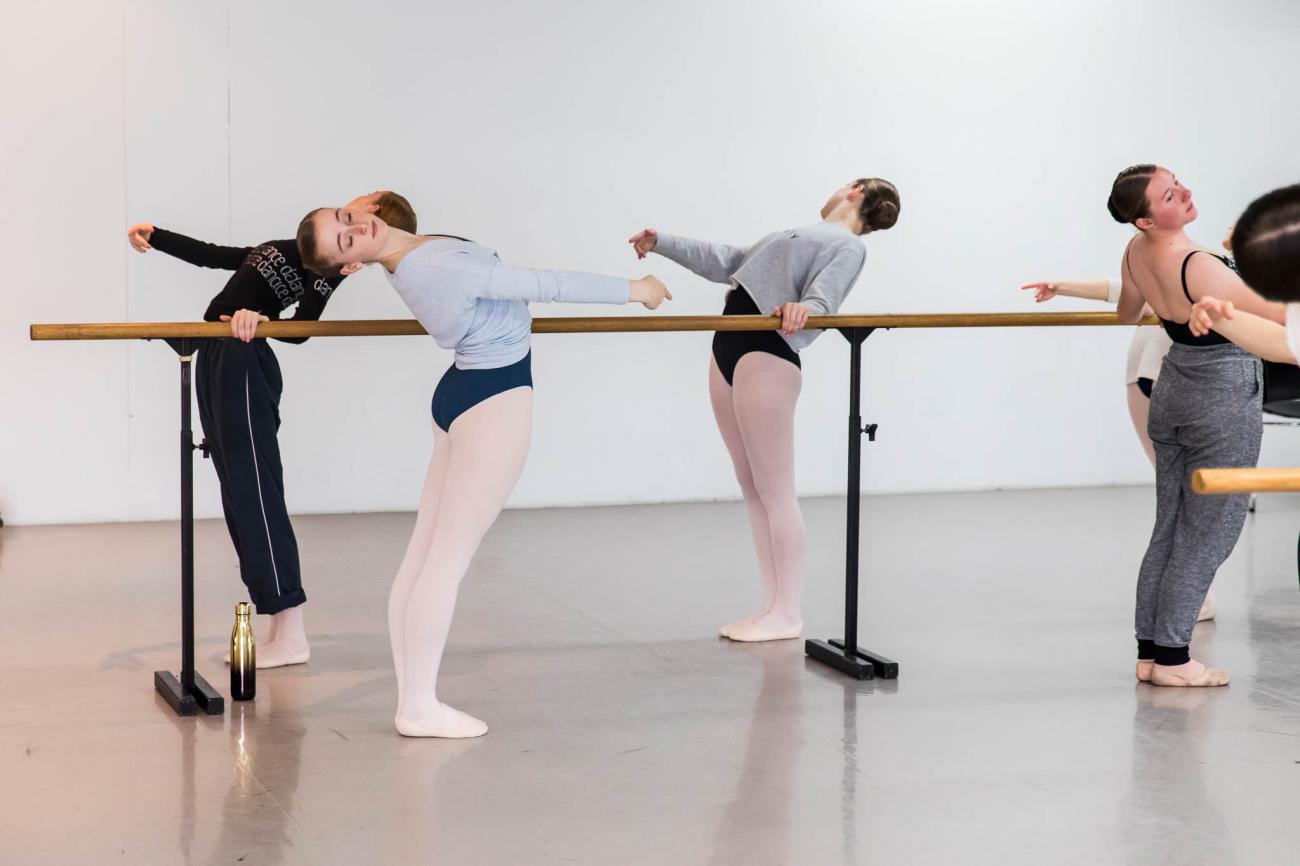 Dancers at ballet barre